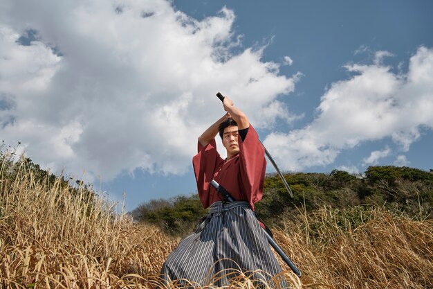 Samurai with sword outdoors