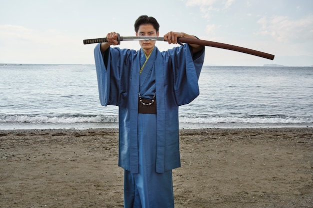 Samurai with sword outdoors