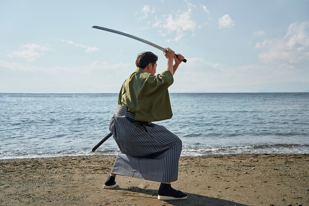 Samurai with sword outdoors