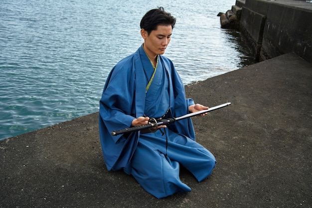 Samurai with sword outdoors