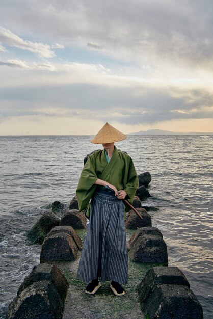 Samurai with sword outdoors