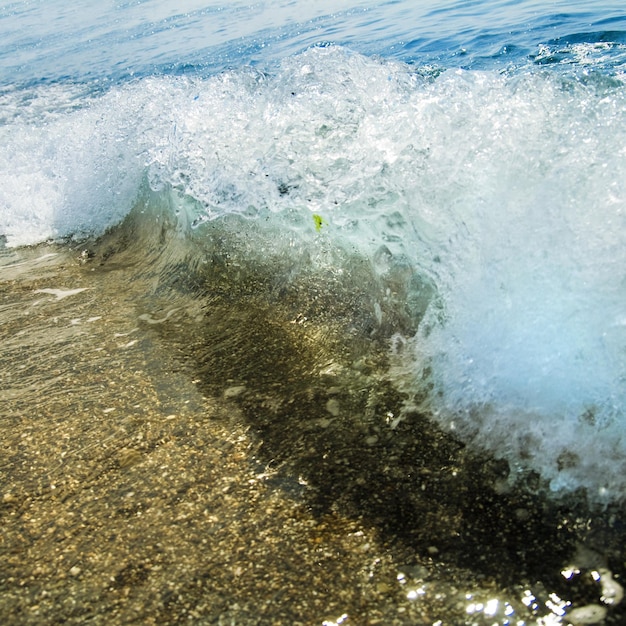 Free photo sand stones and water wave