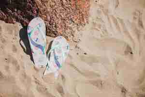 Free photo sandals in the sand