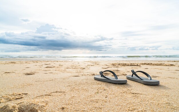 sandals on the sandy sea coast