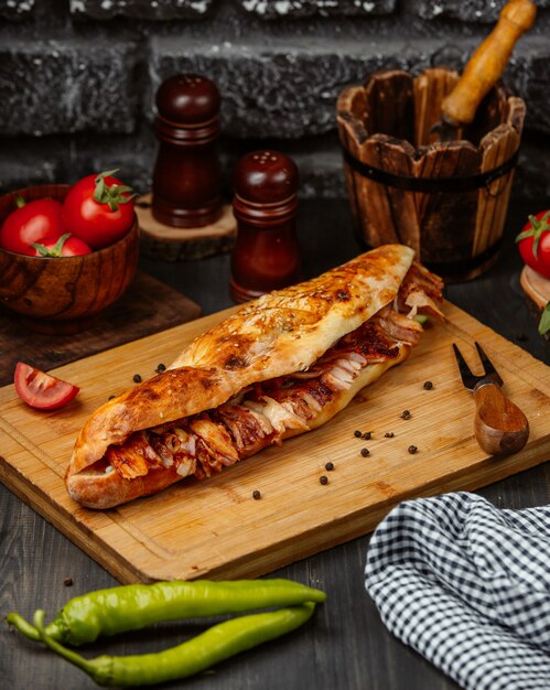 Sandwich in baguette with stuffing.