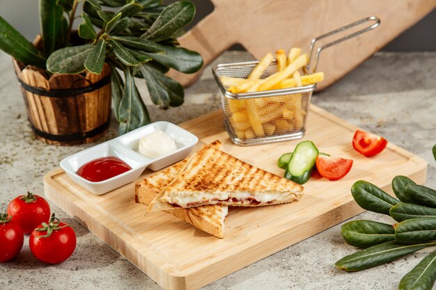 Sandwich served with french fries and vegetables