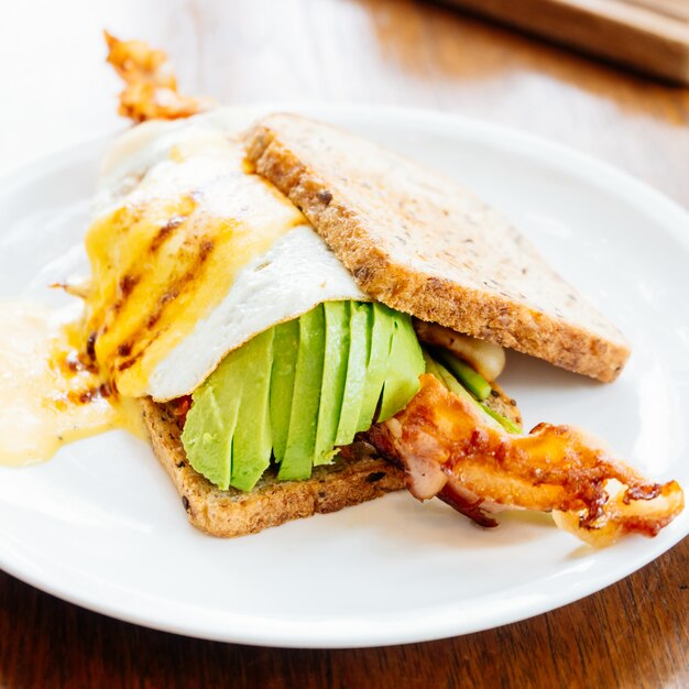 Sandwich with avocado bacon and asparagus