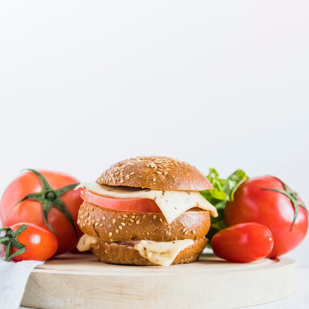 Sandwich with cheese near tomatoes