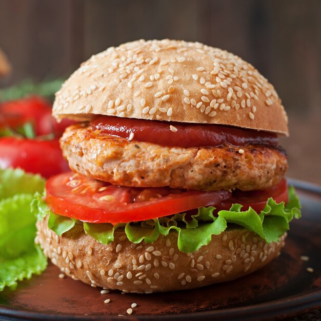 Sandwich with chicken burger, tomatoes and lettuce