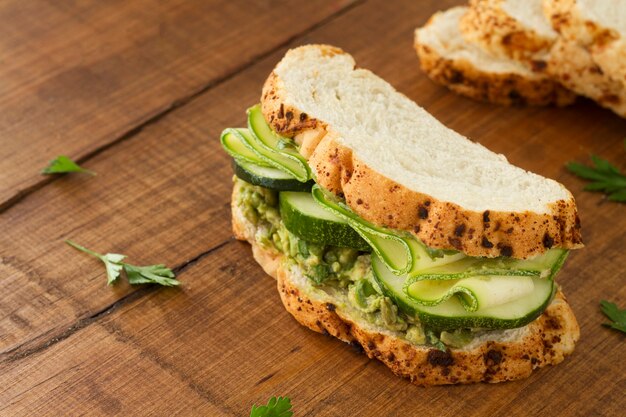 Sandwich with cucumber on desk