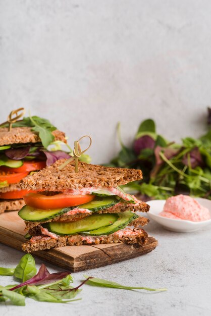 Sandwiches beside bowl with roe