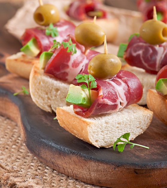 Sandwiches with herring, beetroot and pickled cucumber