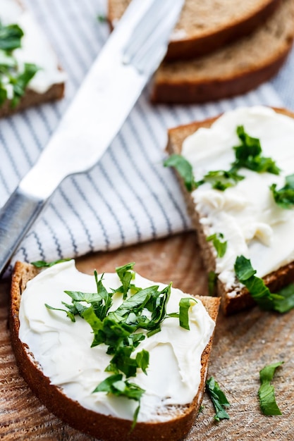 Sandwiches with melted cheese and herbs