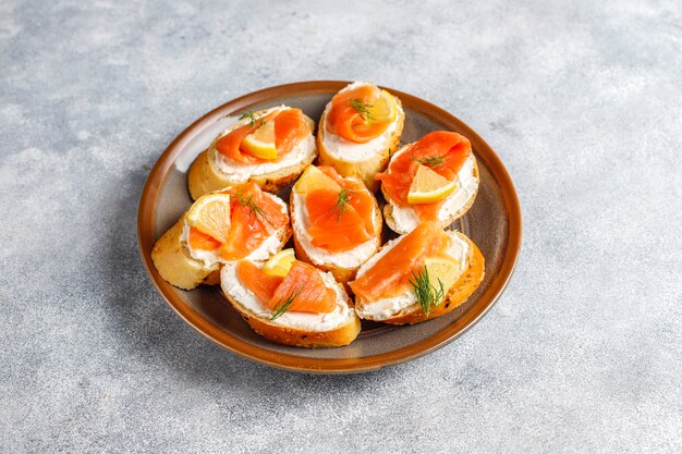 Sandwiches with smoked salmon and cream cheese and dill.