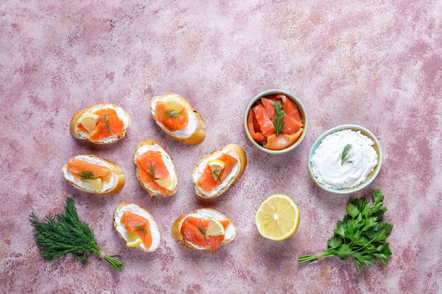 Sandwiches with smoked salmon and cream cheese and dill.