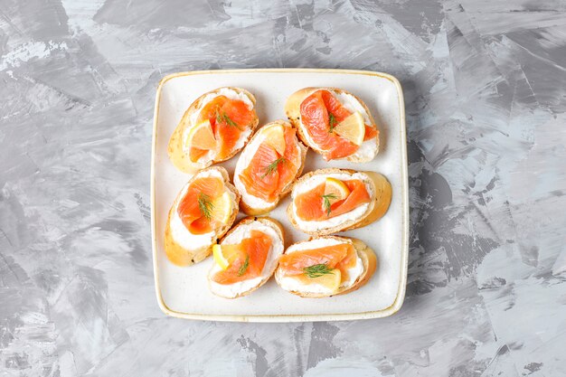 Sandwiches with smoked salmon and cream cheese and dill.