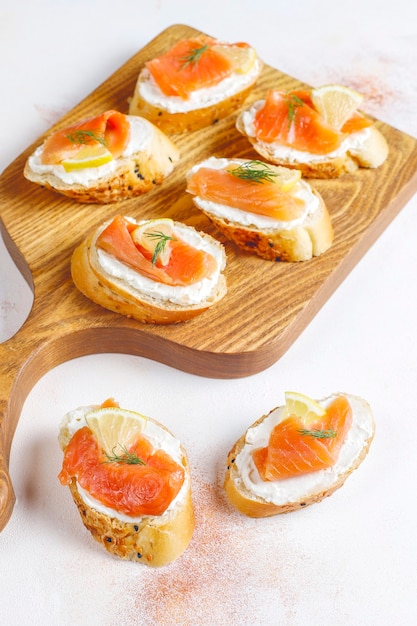 Sandwiches with smoked salmon and cream cheese and dill