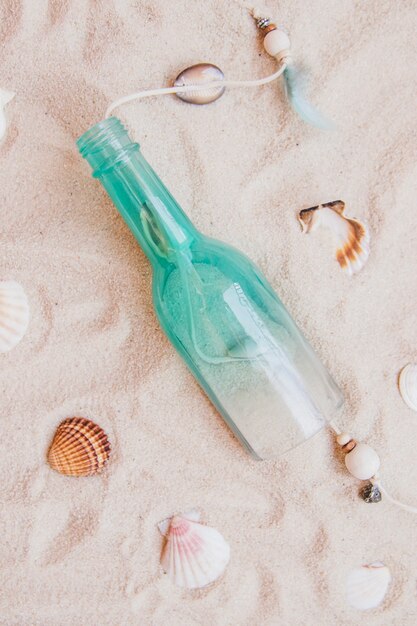 sandy surface with bottle