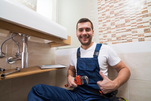 Sanitary technician gesturing thumb up