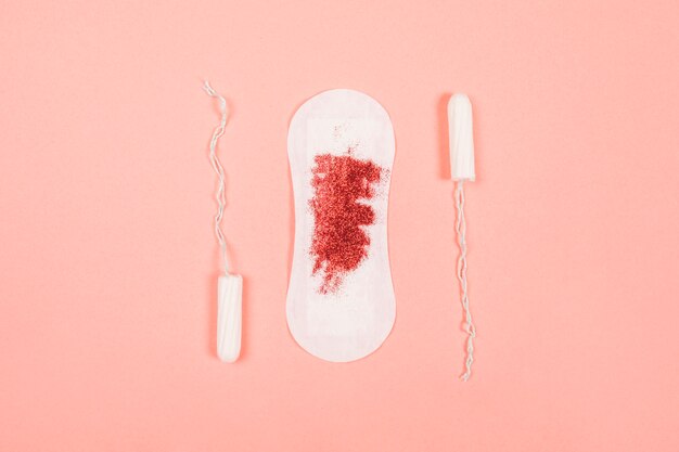 Sanitary towel with glitter and tampons