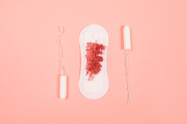 Sanitary towel with glitter and tampons