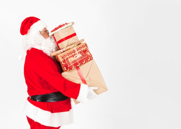 Free photo santa claus bringing christmas presents