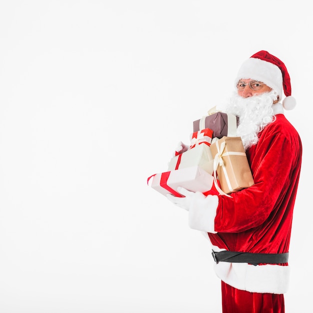 Santa Claus in glasses with gift boxes