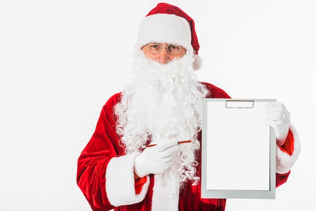 Santa Claus holding blank clipboard