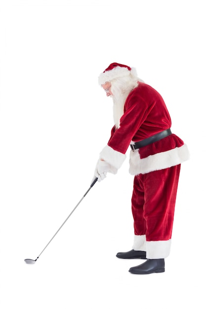 Санта-клаус играет в гольф Premium Фотографии