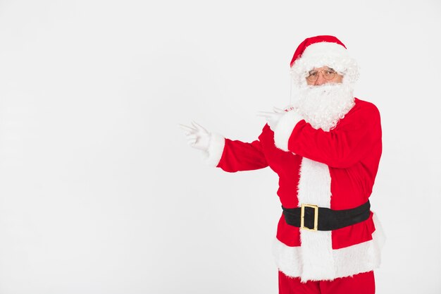 Santa Claus pointing at emptiness