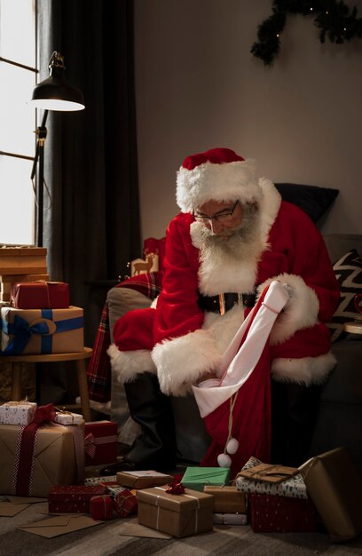 Santa claus preparing his bag of gifts