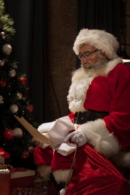 Santa claus reading christmas letter