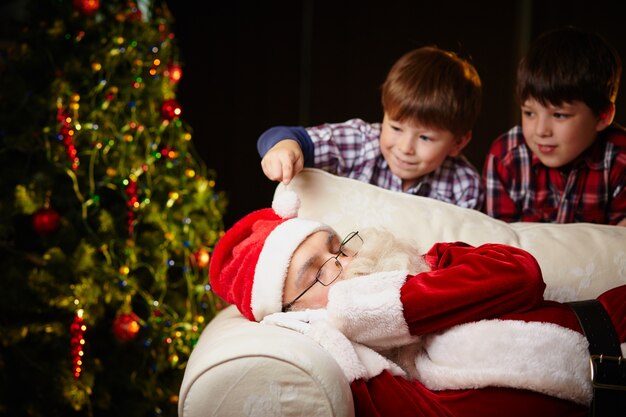 Santa claus sleeping on the couch