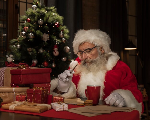 Santa claus at the table thinking