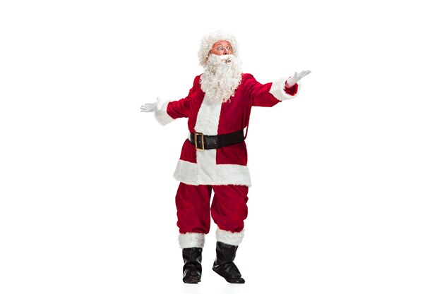 Santa Claus with a Luxurious White Beard, Santa's Hat and a Red Costume isolated on a White Background