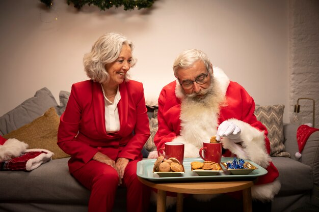 Santa claus and woman celebrating christmas