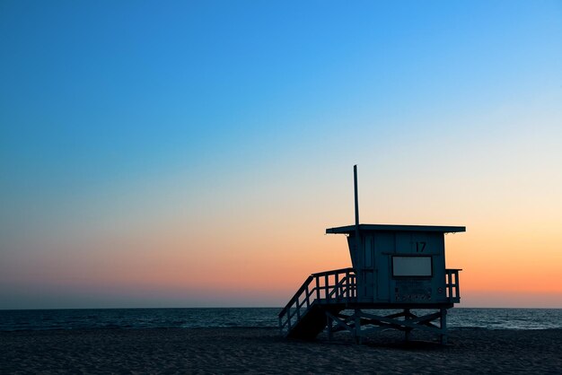 Santa Monica beach safeguard tower at sunset in Los Angeles