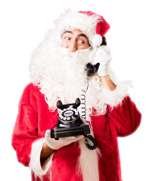 Foto gratuita santa che comunica su un vecchio telefono