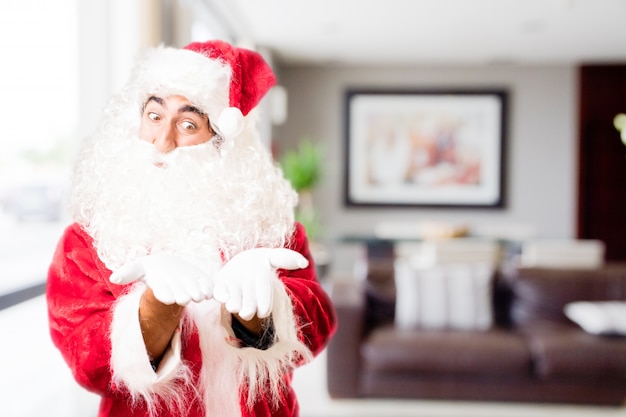 Free photo santa with outstretched hands