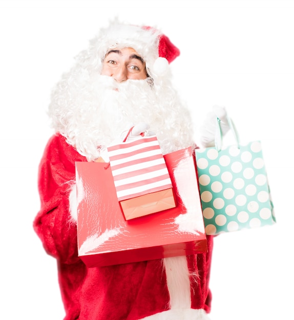 Free photo santa with shopping bags of colors