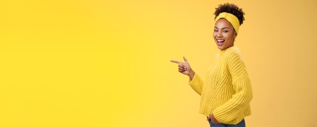 Sassy cute feminine africanamerican girl s in headband sweater smiling cheeky flirty look camera tur