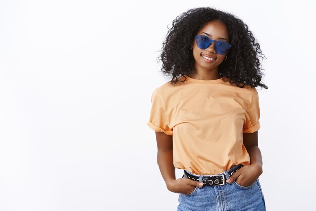 Sassy great-looking african american girl wearing sunglasses