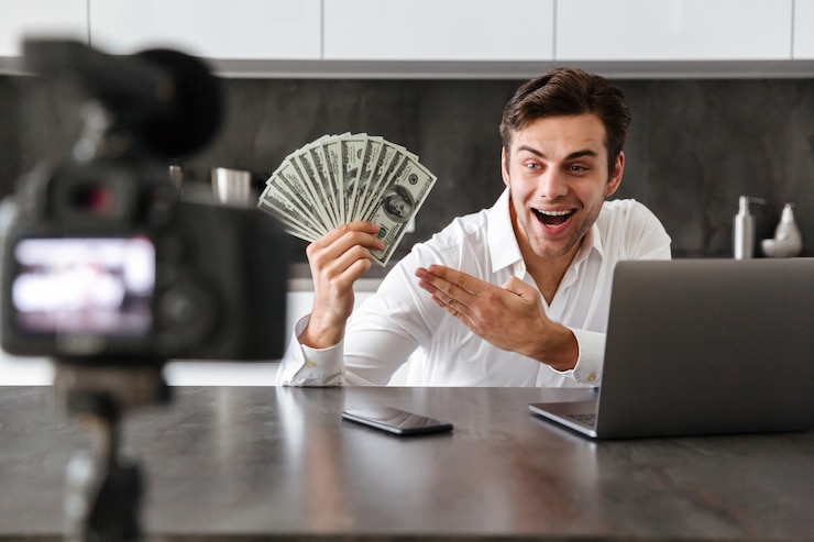 Free Photo satisfied young man filming his video blog episode