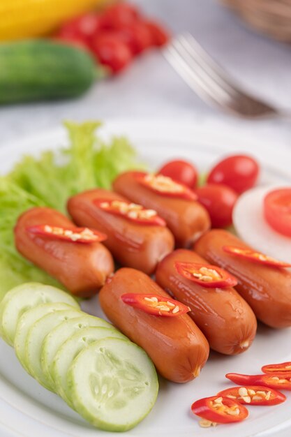 Sausage placed on a white plate.