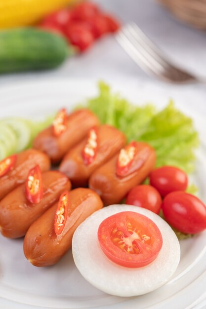 Sausage placed on a white plate.