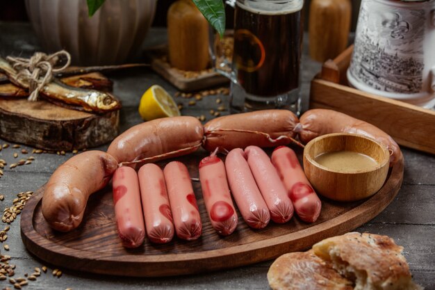 Sausage set on wooden board