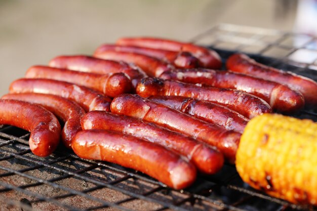 Sausages and corn on the grill