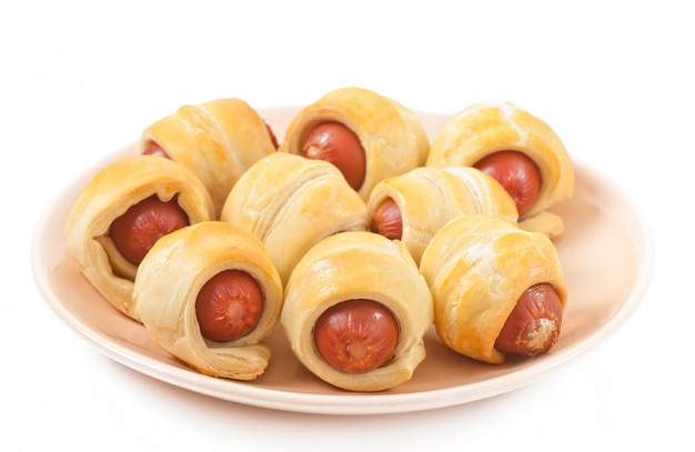 Free photo sausages in dough isolated