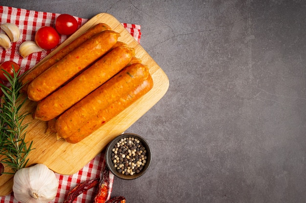 Free photo sausages fried with spices and herbs