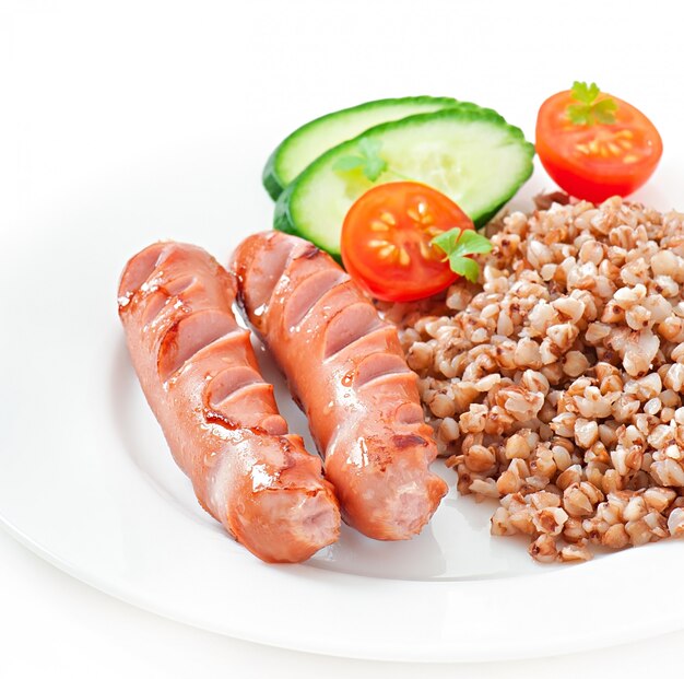 sausages on the grill and salad